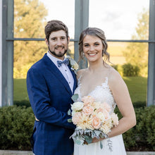 Load image into Gallery viewer, Bride holding the Peach Dahlia, Grandiflora Roses & Dusty Miller Bridal Bouquet, standing beside groom in navy suit – Floral Atelier Australia, Adelaide wedding florist.