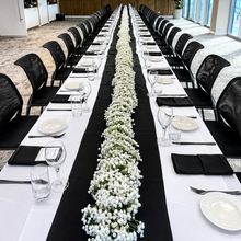 Load image into Gallery viewer, White Faux Baby's Breath table garland creating a continuous 17 meters centerpiece for a corporate dinner event seating 40 guests in Adelaide.