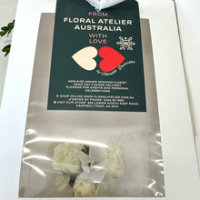 Load image into Gallery viewer, Close-up of the Pure Bliss Adelaide's White Corsage, highlighting the silk spray roses and complementary white botanicals, embodying a young and elegant design
