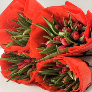 Adelaide Valentines Day Tulips. Four Bouquets wrapped in red paper.