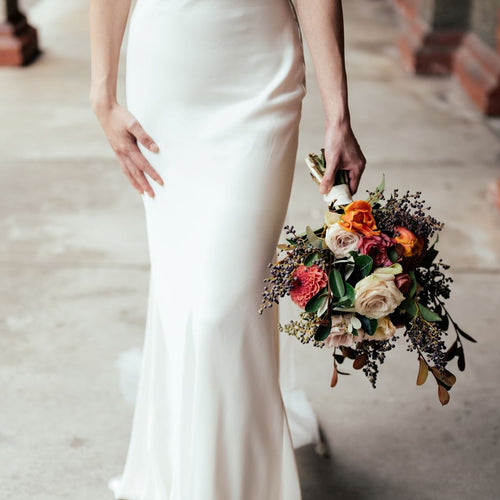 Autumn Noir bridal bouquet with amber roses, taupe blooms, navy foliage, and berries – Floral Atelier Australia, Adelaide wedding florist.