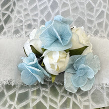 Load image into Gallery viewer, Detailed view of the Blue Mirage Adelaide&#39;s Dream Corsage showcasing the blend of silk spray roses and dried botanicals, perfect for complementing a blue dress at a formal event.

