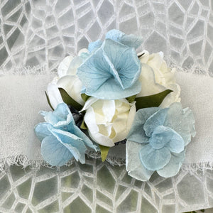 Detailed view of the Blue Mirage Adelaide's Dream Corsage showcasing the blend of silk spray roses and dried botanicals, perfect for complementing a blue dress at a formal event.