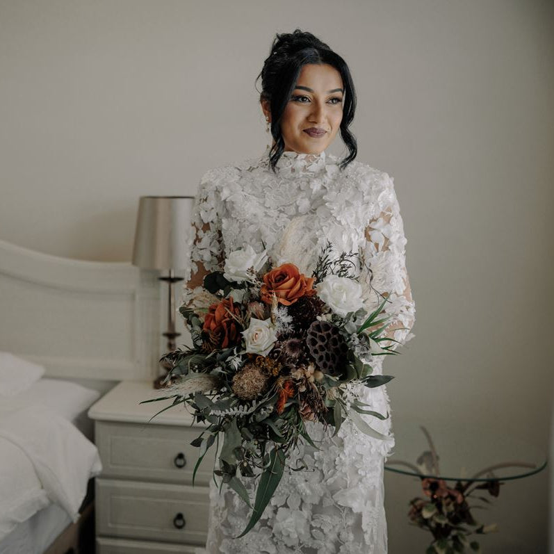 Earth and Ember bridal bouquet with faux toffee roses, dried lotus pods, and native foliage – Floral Atelier Australia, Adelaide wedding florist.