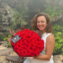 Load image into Gallery viewer, A radiant smile illuminates as a woman holds the Elegant 50 Ferrari Red Roses Bouquet by Floral Atelier Australia, a lavish display of beauty for same day flower delivery in Adelaide, crafted by the city&#39;s esteemed florist.
