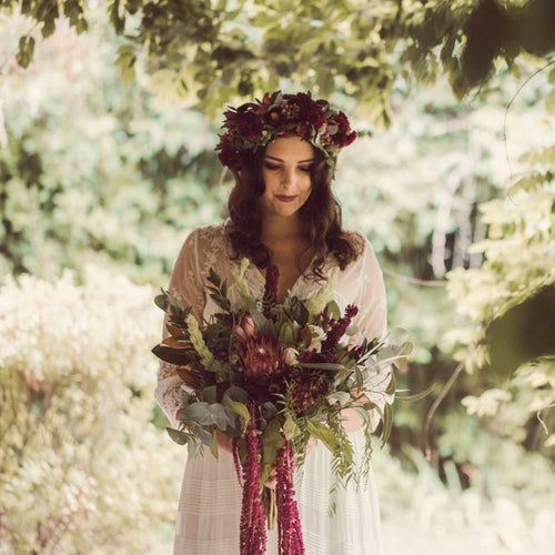Forest Muse bridal bouquet with ice pink Proteas, cascading burgundy Amaranthus, and native foliage – Floral Atelier Australia, Adelaide wedding florist.