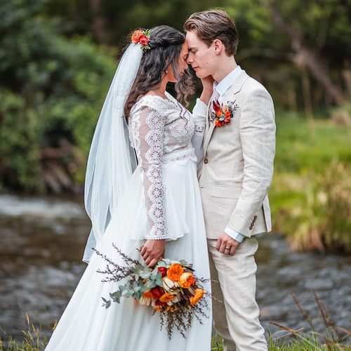 River Ember Bridal Bouquet with orange roses, burgundy foliage, and eucalyptus – Floral Atelier Australia, Adelaide wedding florist.