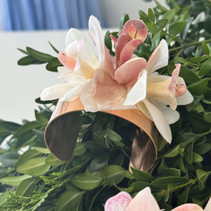 Elegant overview of the Rose Gold Orchid Corsage Cuff, showcasing the full design with two white and one dusty pink silk cymbidium orchids