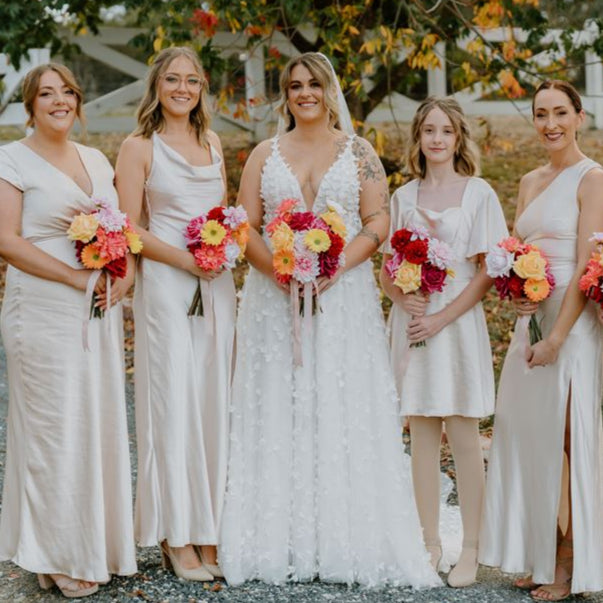 Sunset Pop bridal bouquet with 8 bold blooms in warm tones, no foliage – featuring reflexed roses and dahlias – Floral Atelier Australia, Adelaide wedding florist.