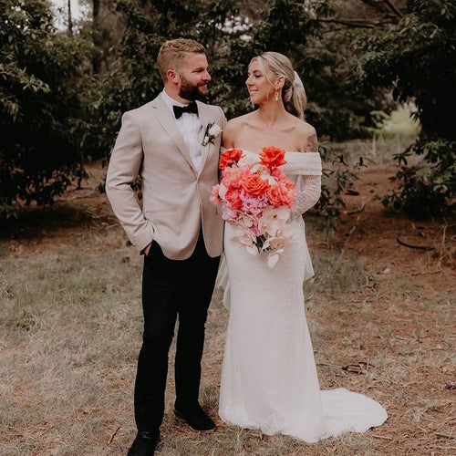 Sunset Reverie bridal bouquet with coral peonies, reflexed Play Bianca roses, and cascading orchids – Floral Atelier Australia, Adelaide wedding florist.