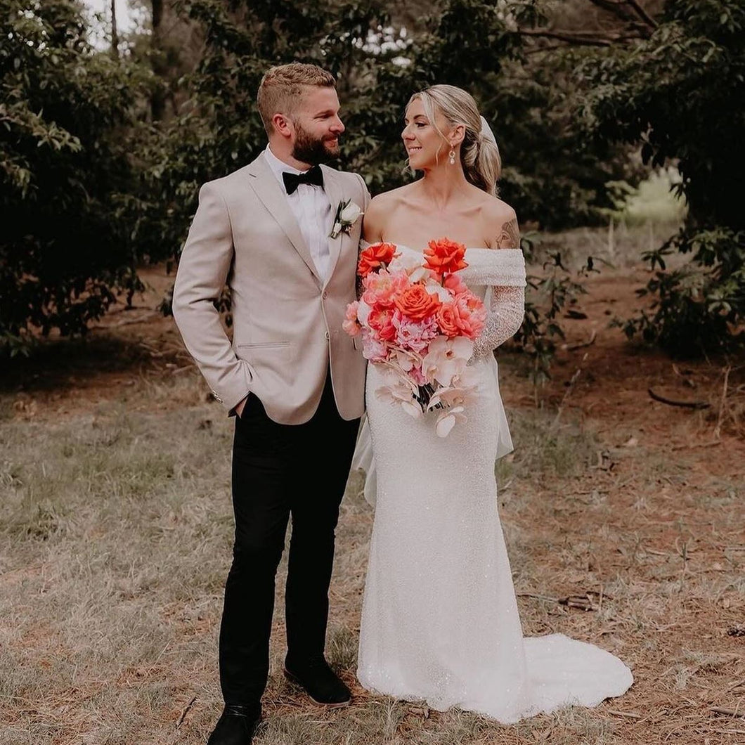 Sunset Reverie bridal bouquet with coral peonies, reflexed Play Bianca roses, and cascading orchids – Floral Atelier Australia, Adelaide wedding florist.