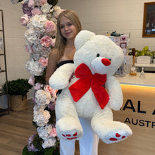 Load image into Gallery viewer, Nicole is holding a white teddy bear at the florist counter. The image made at Floral Atelier Australia n February 2026
