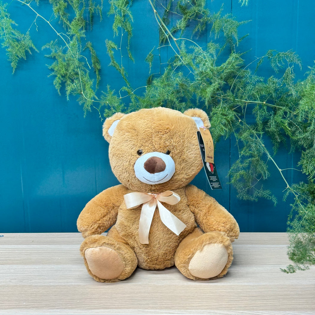 The Teddy Bear Standard from Floral Atelier Australia greets you with a cheerful expression, promising cuddles and comfort with its soft brown fur, perfect for delivery in Adelaide