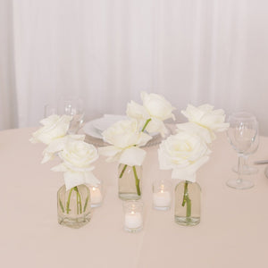 Trio of white roses in bud vases with votive candles and white rose petals – Floral Atelier Australia, Adelaide wedding florist.