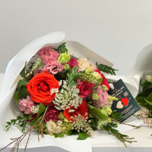 Load image into Gallery viewer, The Vivat Victoria Bouquet Standard, from Floral Atelier Australia, showcases a rich Ferrari Red rose among a lush array of blooms and foliage, embodying the essence of love, available for same day flower delivery in Adelaide
