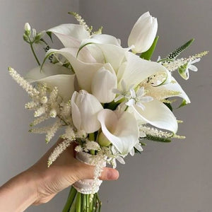 White Calla Lily and White Tulip Bridal Bouquet by Floral Atelier Australia, Adelaide wedding florist. A modern, minimal arrangement in elegant white tones.