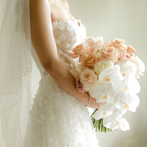 White, Rose, Pink & Champagne Ecuador Rose Bridal Bouquet with cascading orchids by Floral Atelier Australia – sculptural hand-tied design with phalaenopsis orchids and layered Ecuador roses.