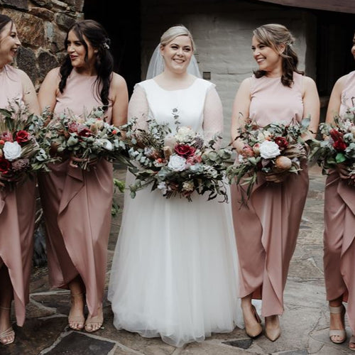 Wild Forest Elegance bridal bouquet with King Protea, silk roses, Banksia, and eucalyptus in a wide, native-inspired shape – Floral Atelier Australia, Adelaide wedding florist.
