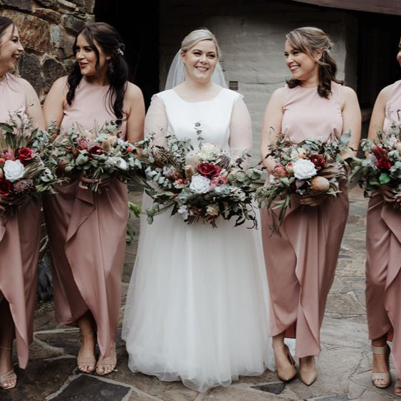 Wild Forest Elegance bridal bouquet with King Protea, silk roses, Banksia, and eucalyptus in a wide, native-inspired shape – Floral Atelier Australia, Adelaide wedding florist.