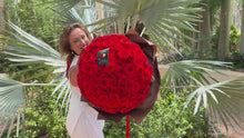 Load and play video in Gallery viewer, Elegant bouquet of 100 premium Ferrari Red Roses with rich, velvety petals, beautifully wrapped in luxurious chocolate brown paper. Handcrafted by Floral Atelier Australia at the Botanic Garden Adelaide, this stunning arrangement is perfect for a romantic proposal, Valentine’s Day, or celebrating deep, lasting love.
