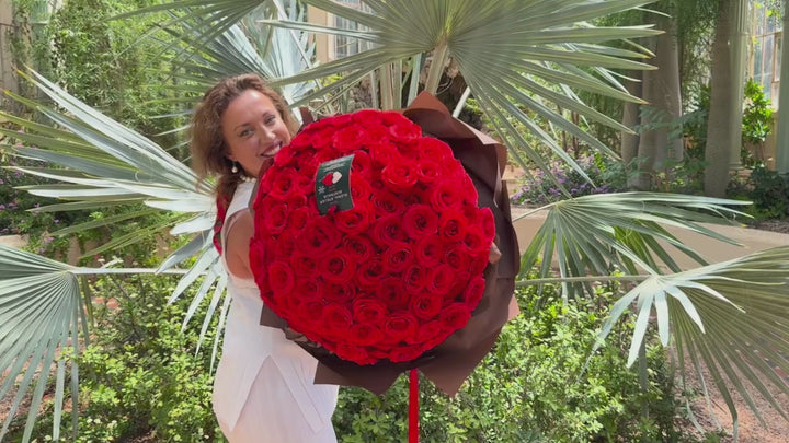 Elegant bouquet of 100 premium Ferrari Red Roses with rich, velvety petals, beautifully wrapped in luxurious chocolate brown paper. Handcrafted by Floral Atelier Australia at the Botanic Garden Adelaide, this stunning arrangement is perfect for a romantic proposal, Valentine’s Day, or celebrating deep, lasting love.