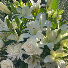 Load image into Gallery viewer, A close-up view of the Pure Life Arrangement, highlighting the delicate white flowers and rich greenery. The detailed shot captures the beauty and freshness of each bloom, conveying a sense of peace and tranquility.
