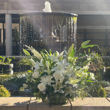 Load image into Gallery viewer, A lavish and grand arrangement of white flowers and abundant greenery, showcasing the Pure Life Arrangement in deluxe size. Perfect for conveying heartfelt condolences with its impressive and dignified display
