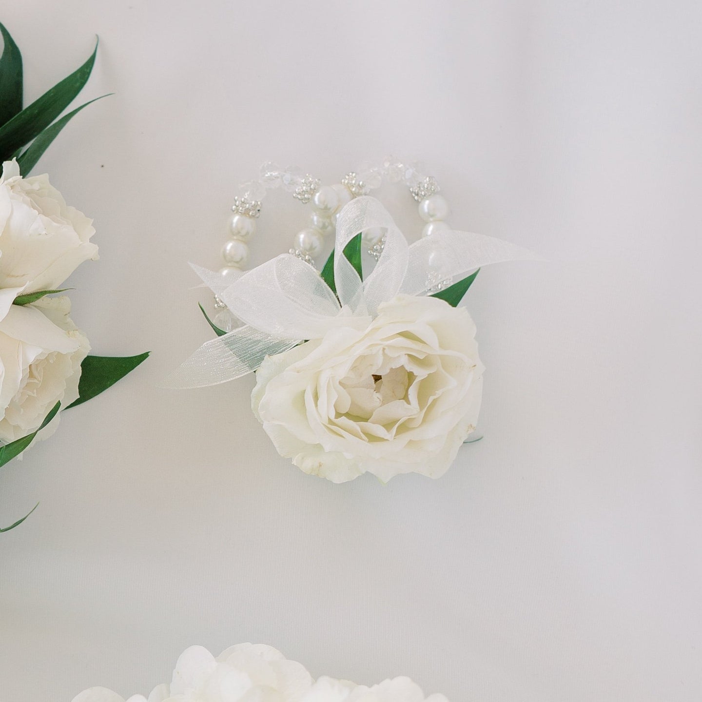 White rose wrist corsage with pearl bracelet – Floral Atelier Australia, Adelaide wedding florist