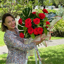 Load image into Gallery viewer, Monstera Leaves Dozen Ferrari Red Roses
